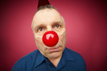 Unhappy Man With Red Nose