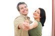 © Alliance - Smiling young couple dancing at home