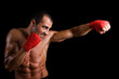 © cristovao31 - Young Boxer fighter over black background