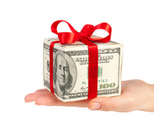 Dollars In The Form Of A Gift Box In Hand Isolated On White