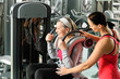 © CandyBox Images - Senior woman exercise with personal trainer