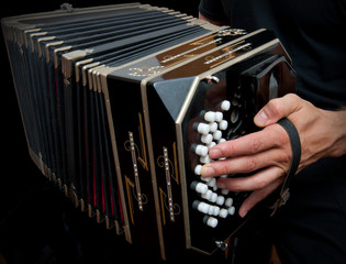 Playing traditional bandoneon.