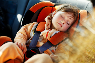 Wall Mural - baby girl  in car