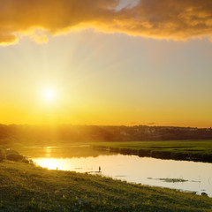 Wall Mural - dramatic sunset over river