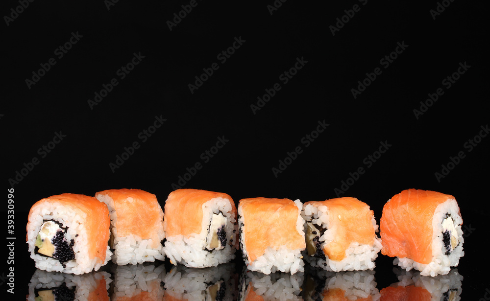 Tasty rolls in line isolated on black