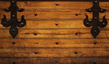 Metal Hinges On Wooden Background.