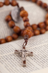 rosary on holy bible