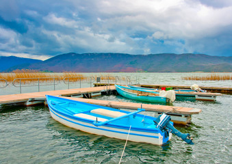 Naklejka na meble Old wooden fishing boats in the lake Prespa in Greece.