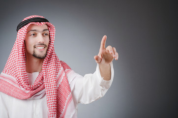 Arab pushing virtual buttons