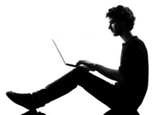 Young Man Silhouette Sitting Computing Laptop