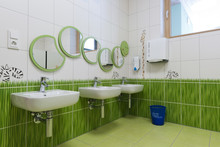Bathroom With Mirrors Arranged As Caterpillar In Kindergarten