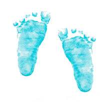 Imprints Of Baby Feet On White Background