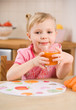 little girl with carrot juice