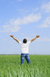 © Aleksandr Kurganov - man take energy from nature in the meadow