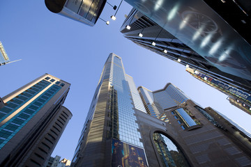 Wall Mural - Look to the sky surrounded by skyscrapers