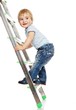 © Nejron Photo - Cute little boy climbing on a ladder.