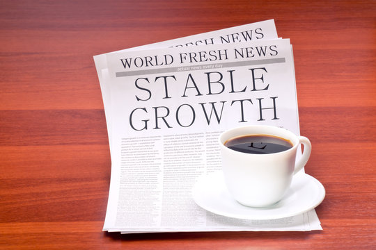 Newspaper and cup of coffee