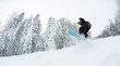 © .shock - snowboarder on fresh deep snow
