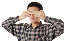 Portrait Of A Young Man Covering His Eyes With Hands