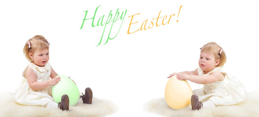 Two baby girls with easter eggs, isolated on white