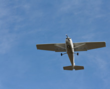 Small Fixed Wing Plane Against A Clear Blue Sky