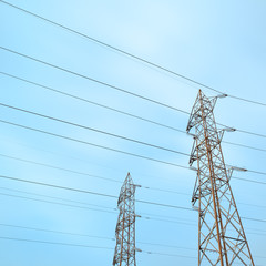 Two transmission towers, also known as electricity pylons.