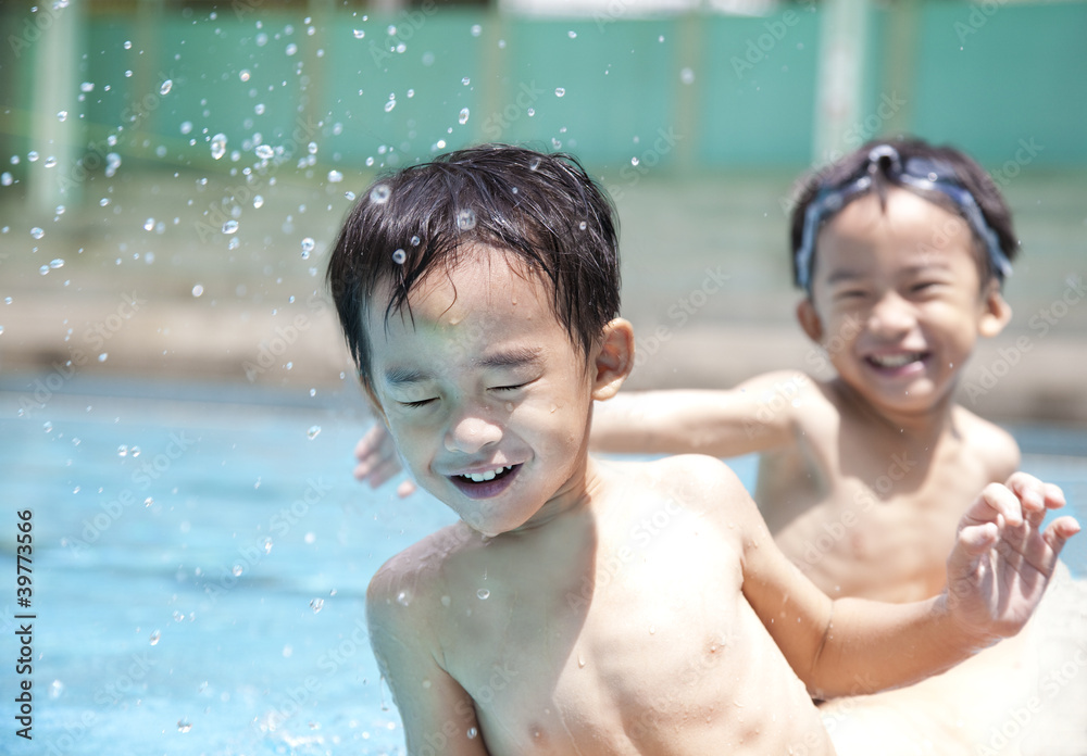happy kids in swimming pool Stock Photo | Adobe Stock