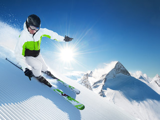 Wall Mural - Skier in high mountains at sunny day