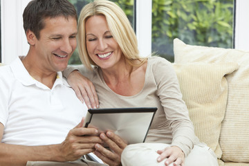 Happy Man & Woman Couple Using Tablet Computer