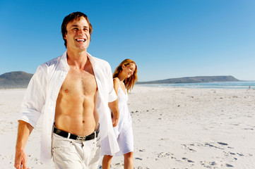 Wall Mural - carefree walking beach couple