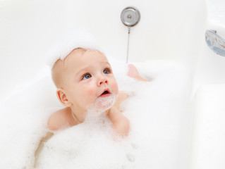 Infant in soap foam