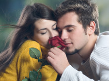 Couple With Rose Outdoors
