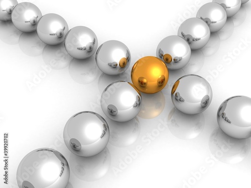gold ball in center of many metal balls