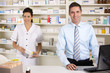 © Monkey Business - UK nurse and pharmacist working in pharmacy