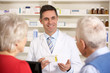 © Monkey Business - American pharmacist with senior couple in pharmacy