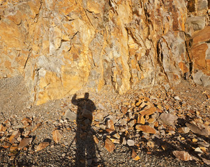 Poster - Shadow of a man photographing a cuarry