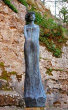 Woman Statue In Eze Village Near Its Church Building.