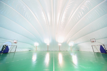 Empty indoor sports ground, plastic white ceiling and walls