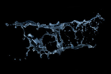 Wall Mural - water splash isolated on black background
