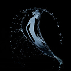Wall Mural - water splash isolated on black background