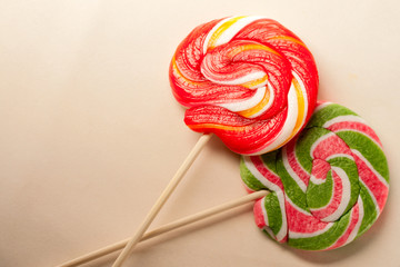 Bright lollipop candy on paper background