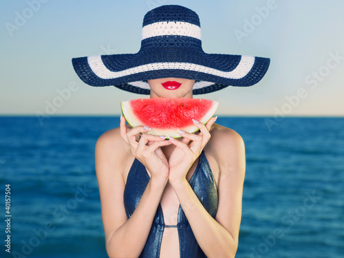 Obraz w ramie Young lady at sea with watermelon