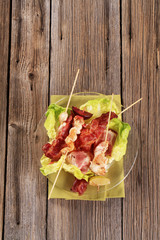 Sticker - Chicken skewers and crispy bacon