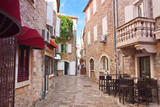 Fototapeta Uliczki - view narrow street in old district of Budva, Montenegro