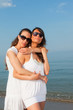 © william87 - Two Female Friends Embraced on the Beach