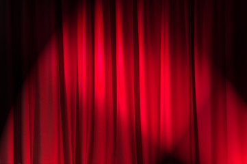 Brightly lit curtains in theatre concept