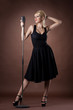 © Wisky - Passion singer with microphone on dark background