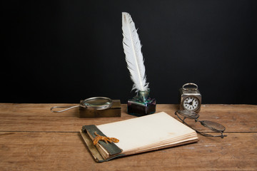 Wall Mural - Notepad, quill, inkwell, magnifying glass, clock, specs on wood