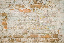 Old Brick Wall With Peeling Paint