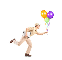 Canvas Print - Delivery boy in a rush delivering balloons